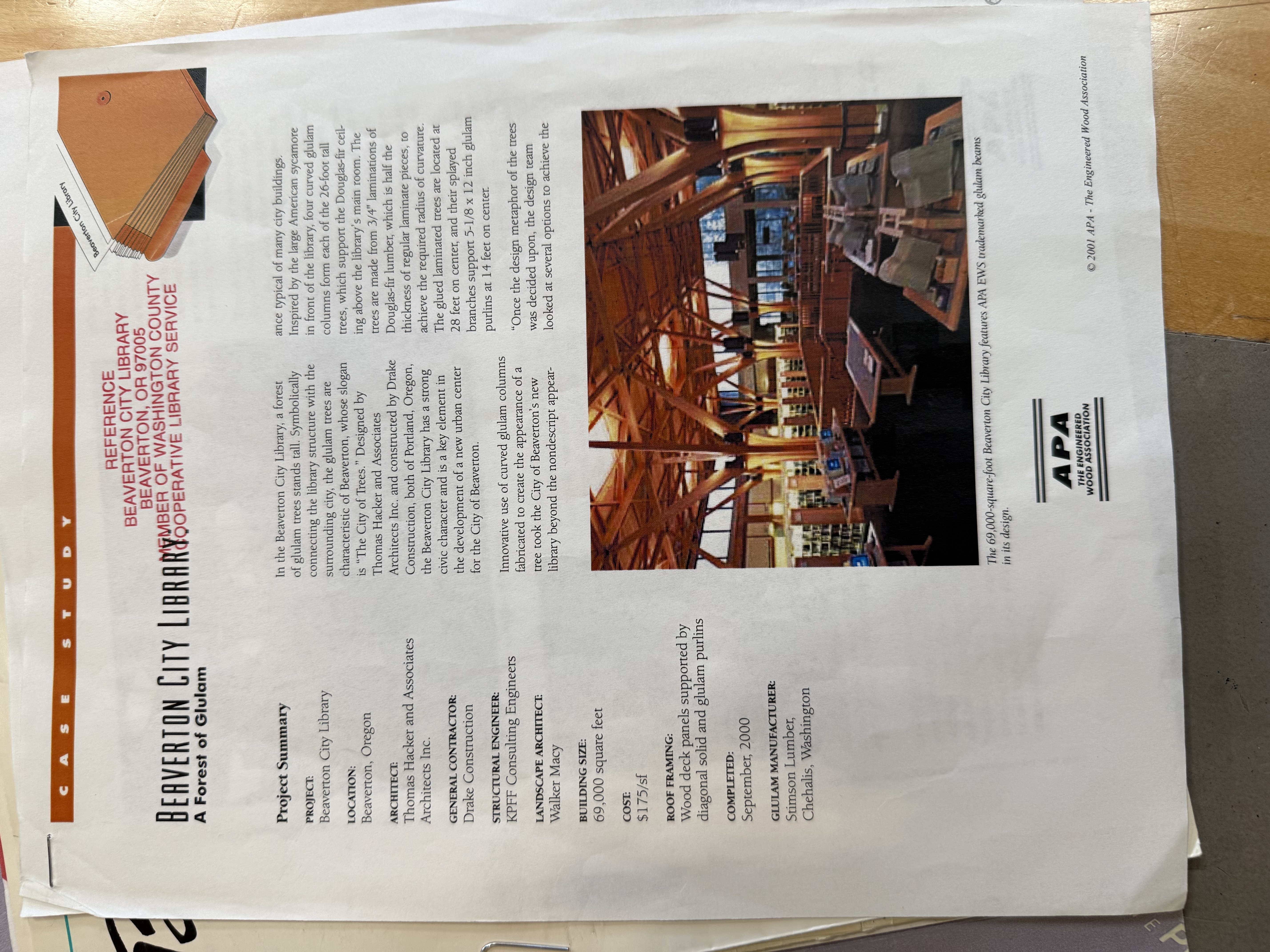 APA case study document: 'Beaverton City Library — A Forest of Columns' showing project summary and interior timber photo