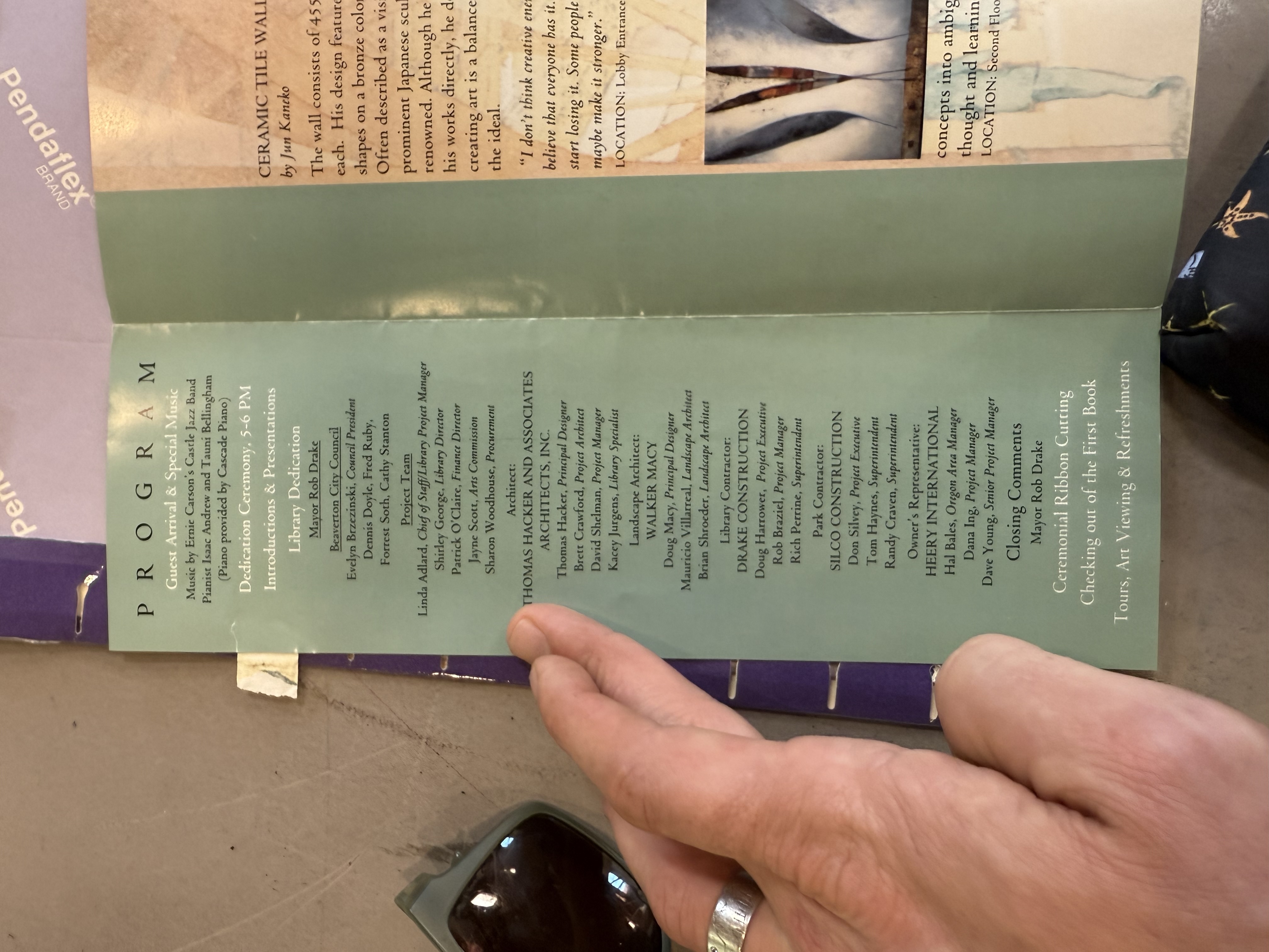 Full dedication ceremony pamphlet opened, showing program and ceramic tile wall description