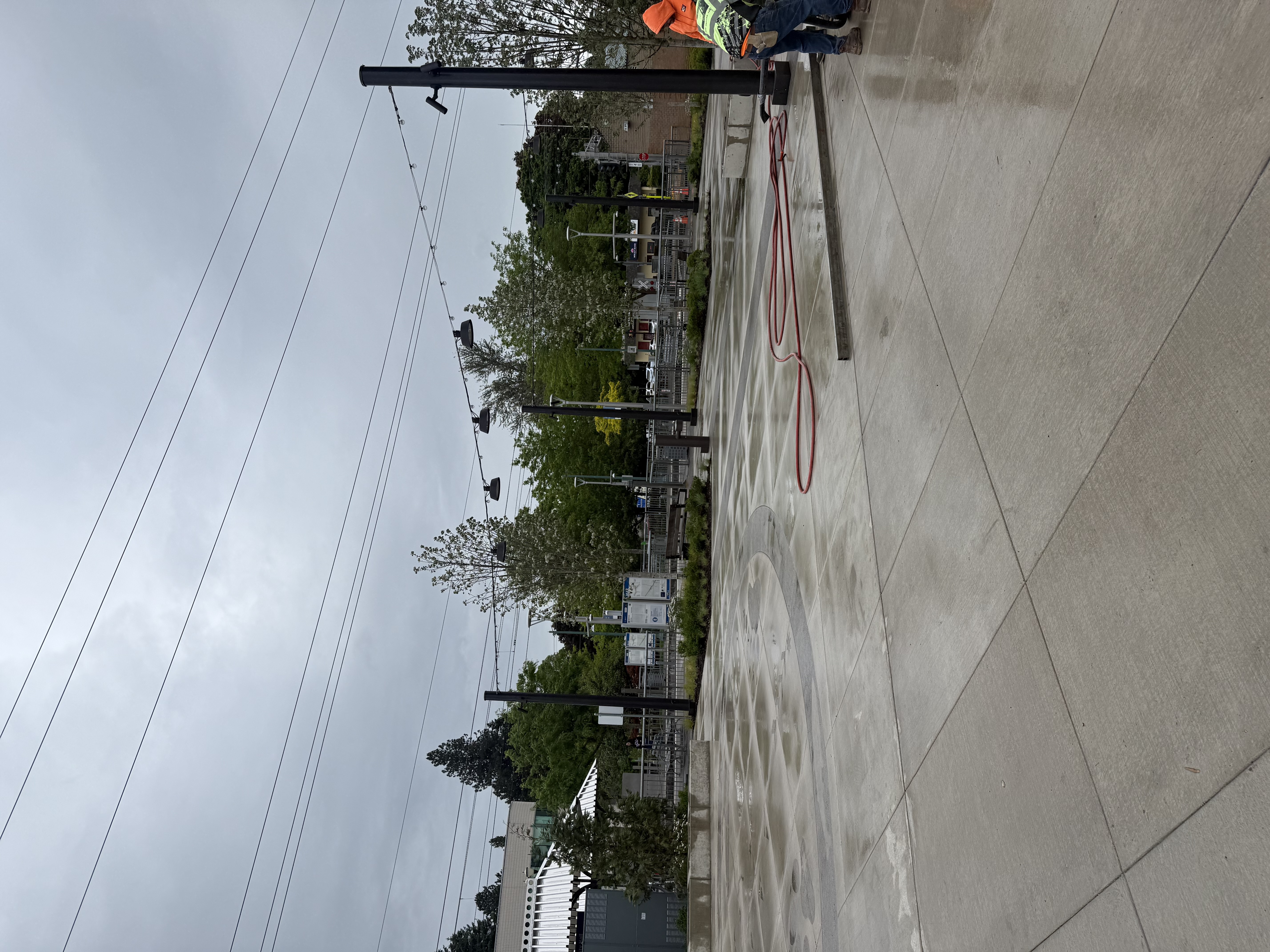 Whitaker Ellis crew finishing the concrete pour on the large ADA-accessible patio at the East Portland Library